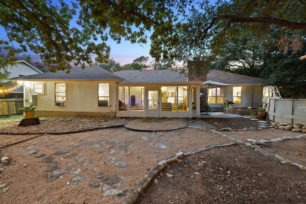 1709 Crested Butte Drive Austin, TX 78746 - Photo 33 of 40 a view of a house with a yard and large tree