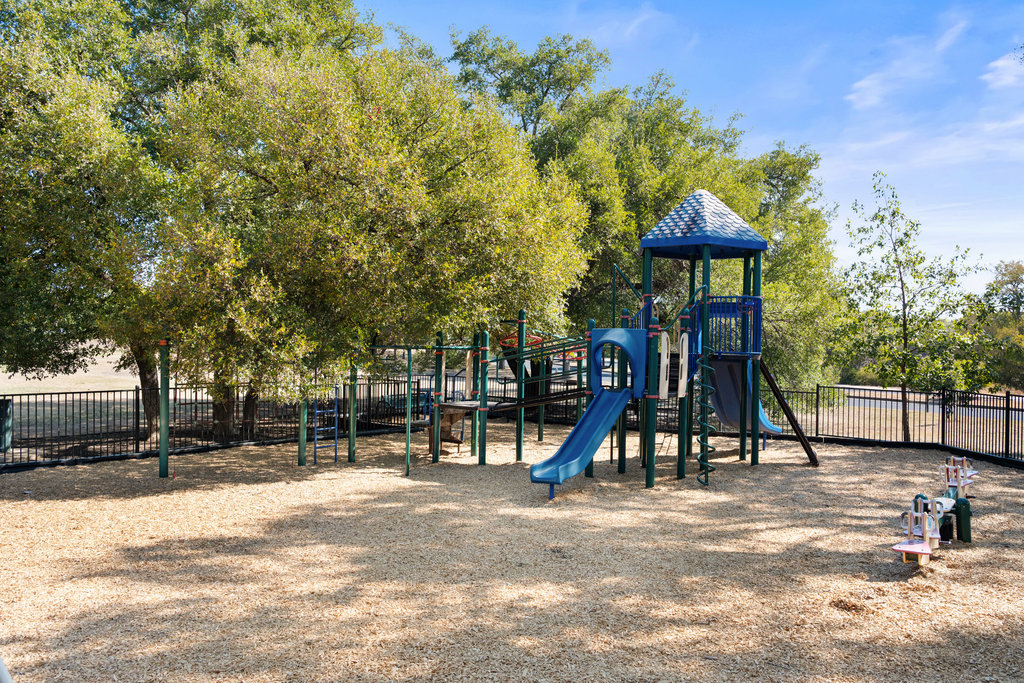 1709 Crested Butte Drive Austin, TX 78746 - Photo 37 of 40 a view of park with swings