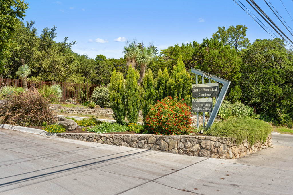 1709 Crested Butte Drive Austin, TX 78746 - Photo 39 of 40 a view of a garden with a pathway