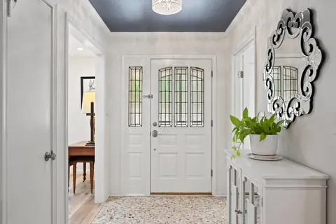 a view of entryway with wooden floor