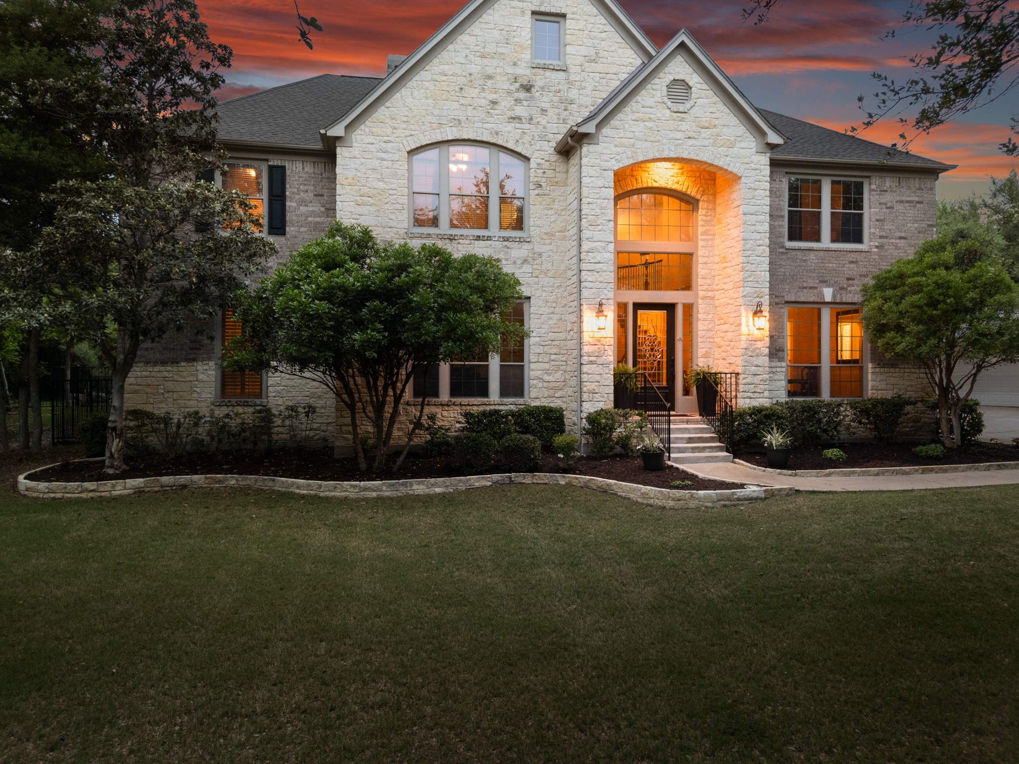 3609 Goodnight Trail Leander, TX 78641 - Photo 1 of 39 a front view of a house with a garden