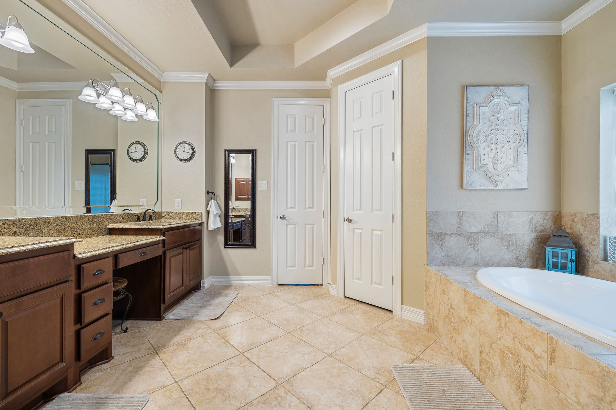 3609 Goodnight Trail Leander, TX 78641 - Photo 19 of 39 a large bathroom with a sink a vanity a large mirror and a shower
