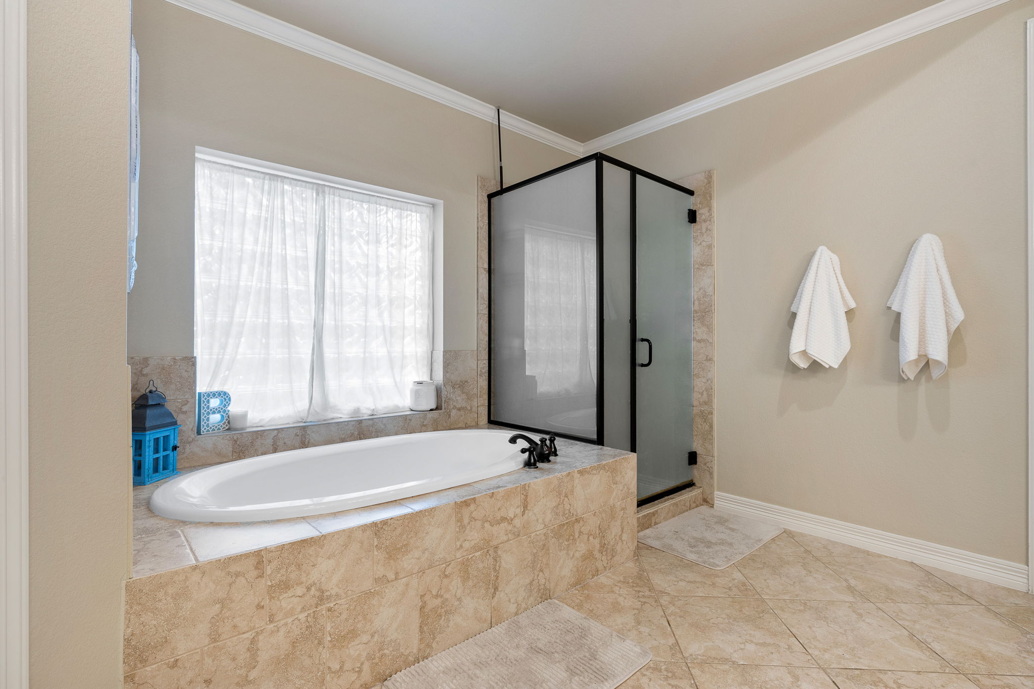 3609 Goodnight Trail Leander, TX 78641 - Photo 20 of 39 a bathroom with a bathtub and a shower