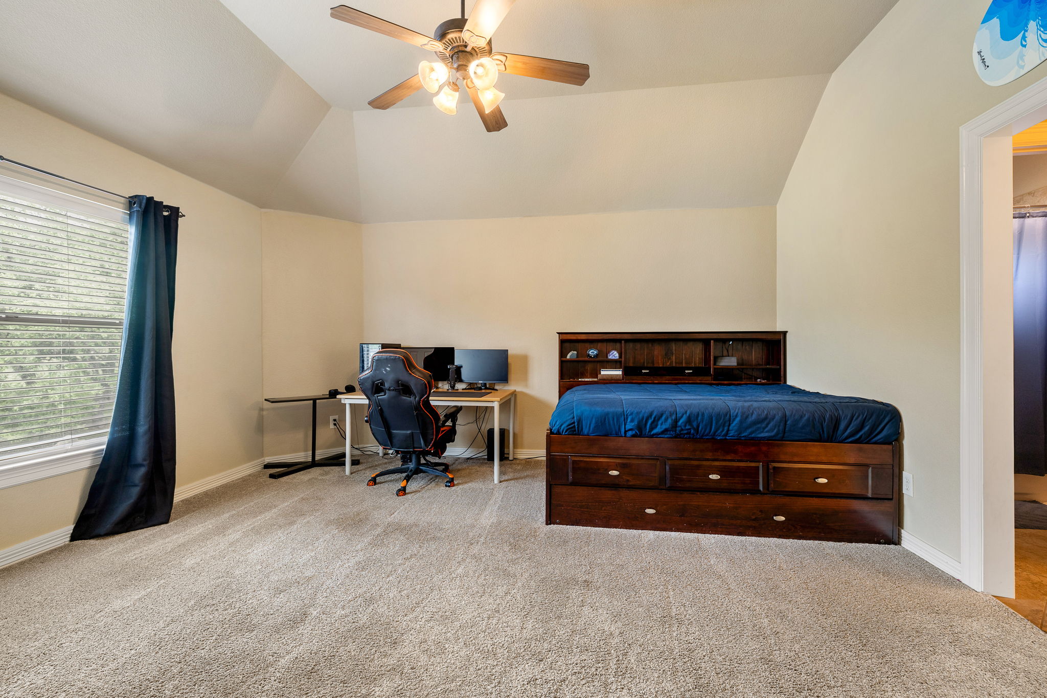 3609 Goodnight Trail Leander, TX 78641 - Photo 26 of 39 a room with a bed and a chandelier