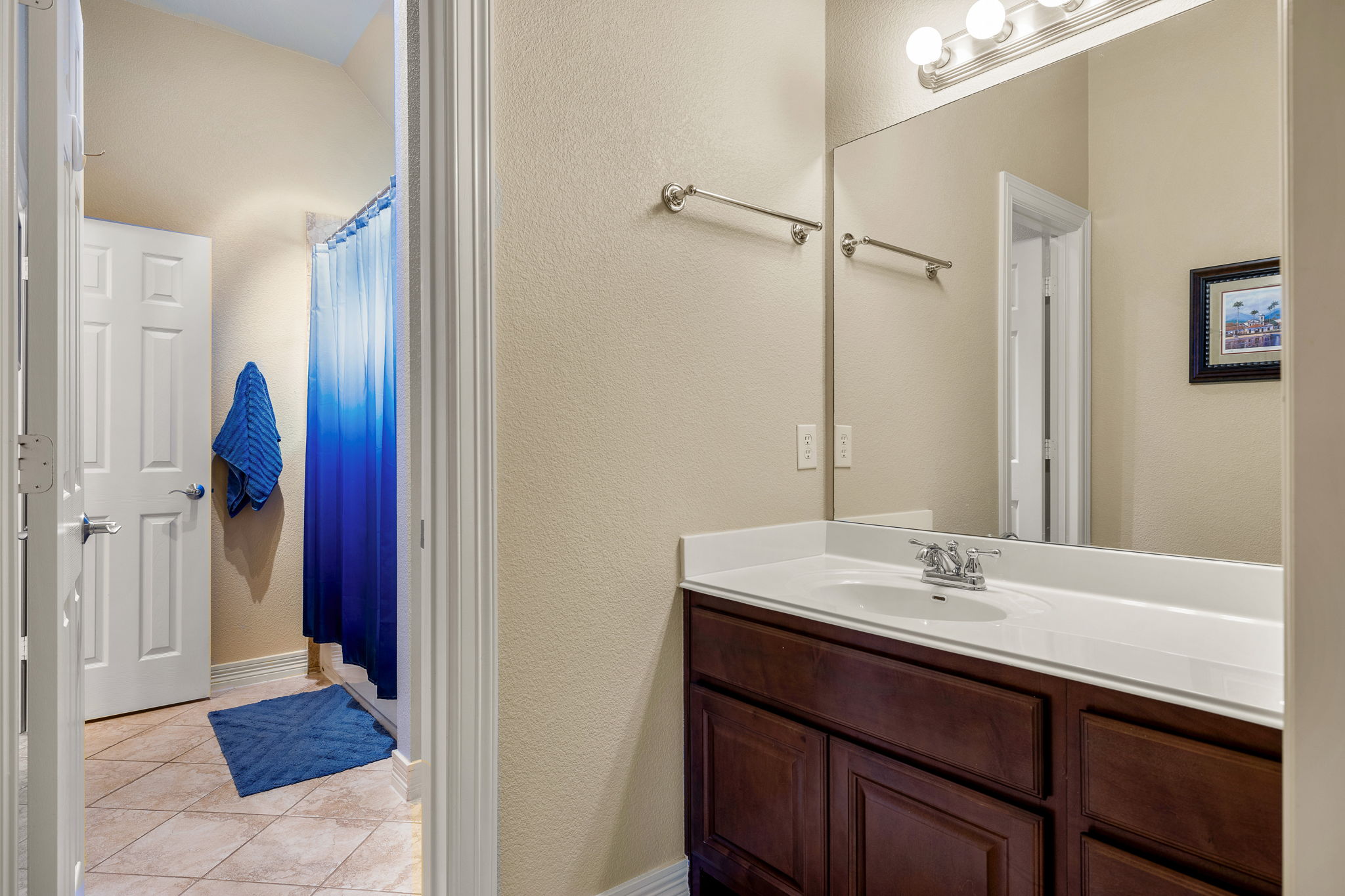 3609 Goodnight Trail Leander, TX 78641 - Photo 27 of 39 a bathroom with a sink and a mirror