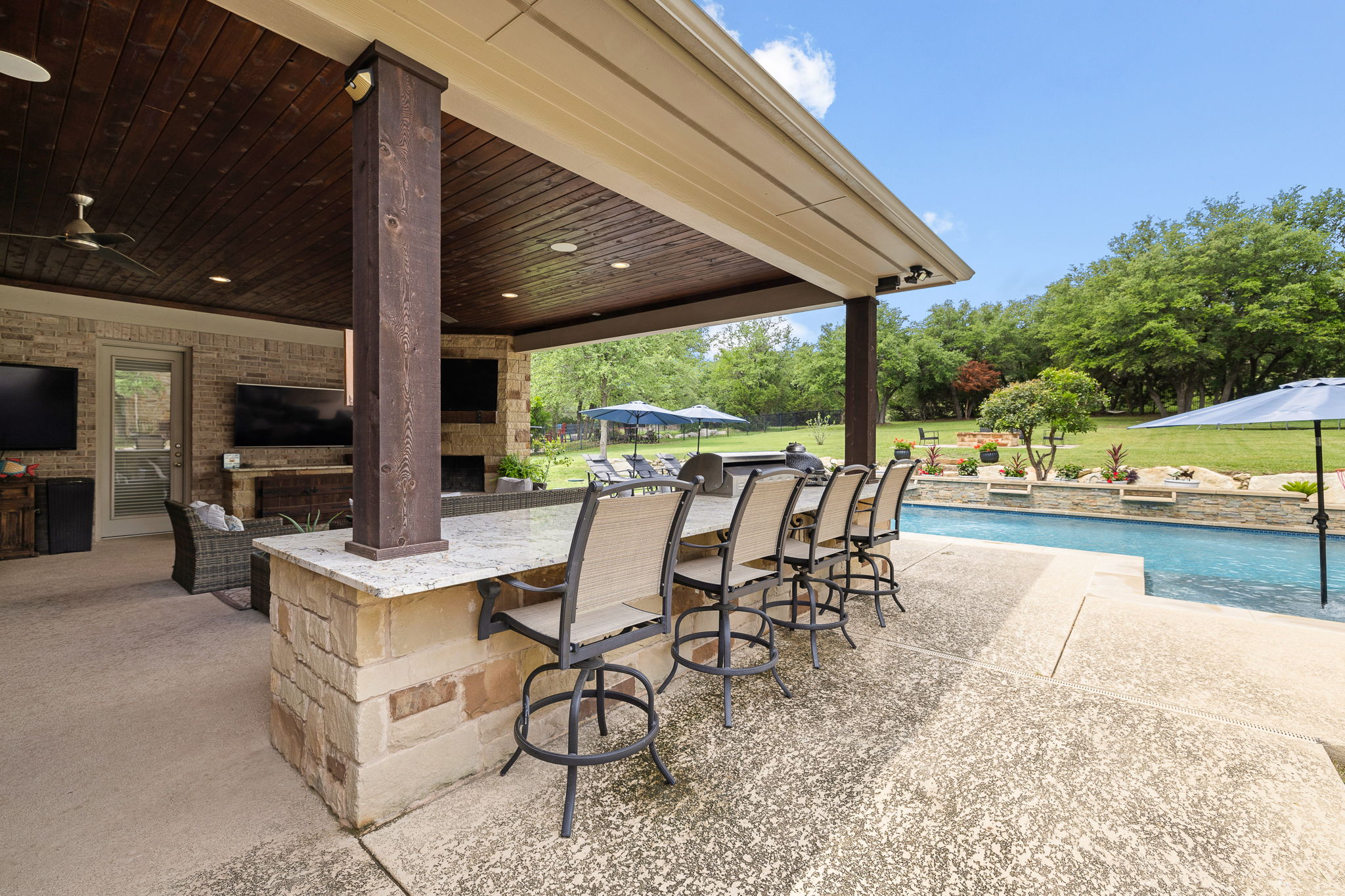 3609 Goodnight Trail Leander, TX 78641 - Photo 34 of 39 a view of a patio with a table chairs and backyard