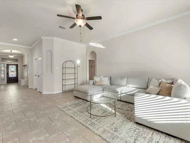 a kitchen with stainless steel appliances kitchen island granite countertop a refrigerator stove and oven