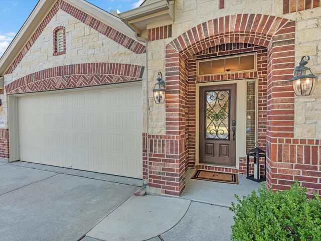 a front view of a house with a garage