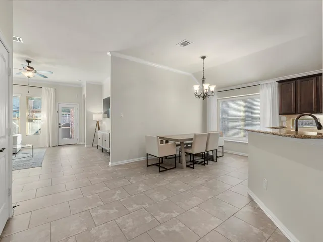 a view of a kitchen with microwave and cabinets