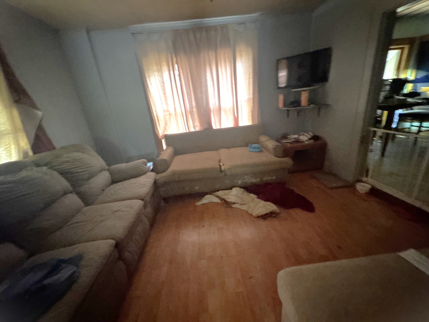 309 West Commercial Street Neponset, IL 61345 - Photo 6 of 9 a living room with furniture and a flat screen tv
