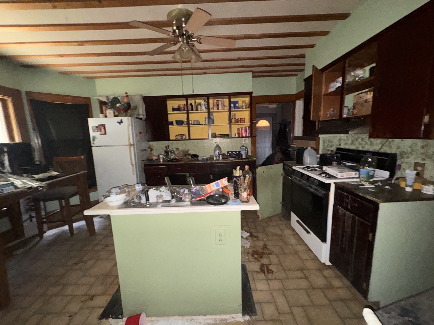 309 West Commercial Street Neponset, IL 61345 - Photo 7 of 9 a living room with stainless steel appliances kitchen island granite countertop a stove and a refrigerator