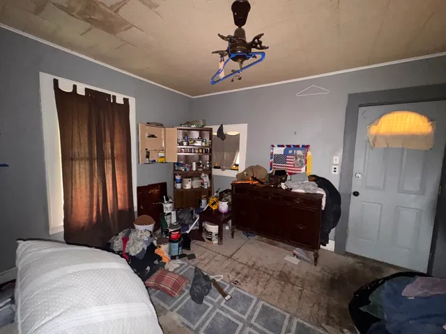 a bed room with a bed and a gym