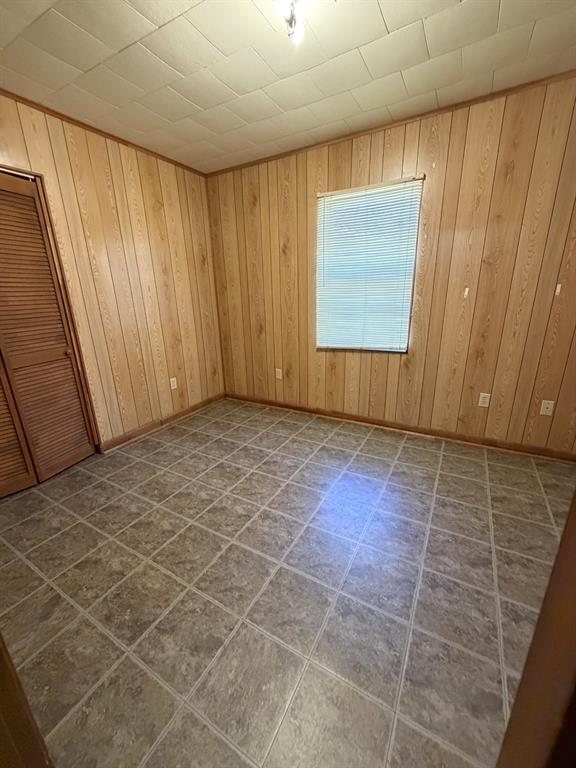 134 Hope Street Mansfield, LA 71052 - Photo 22 of 23 Master bedroom view 1 with wood walls and baseboards
