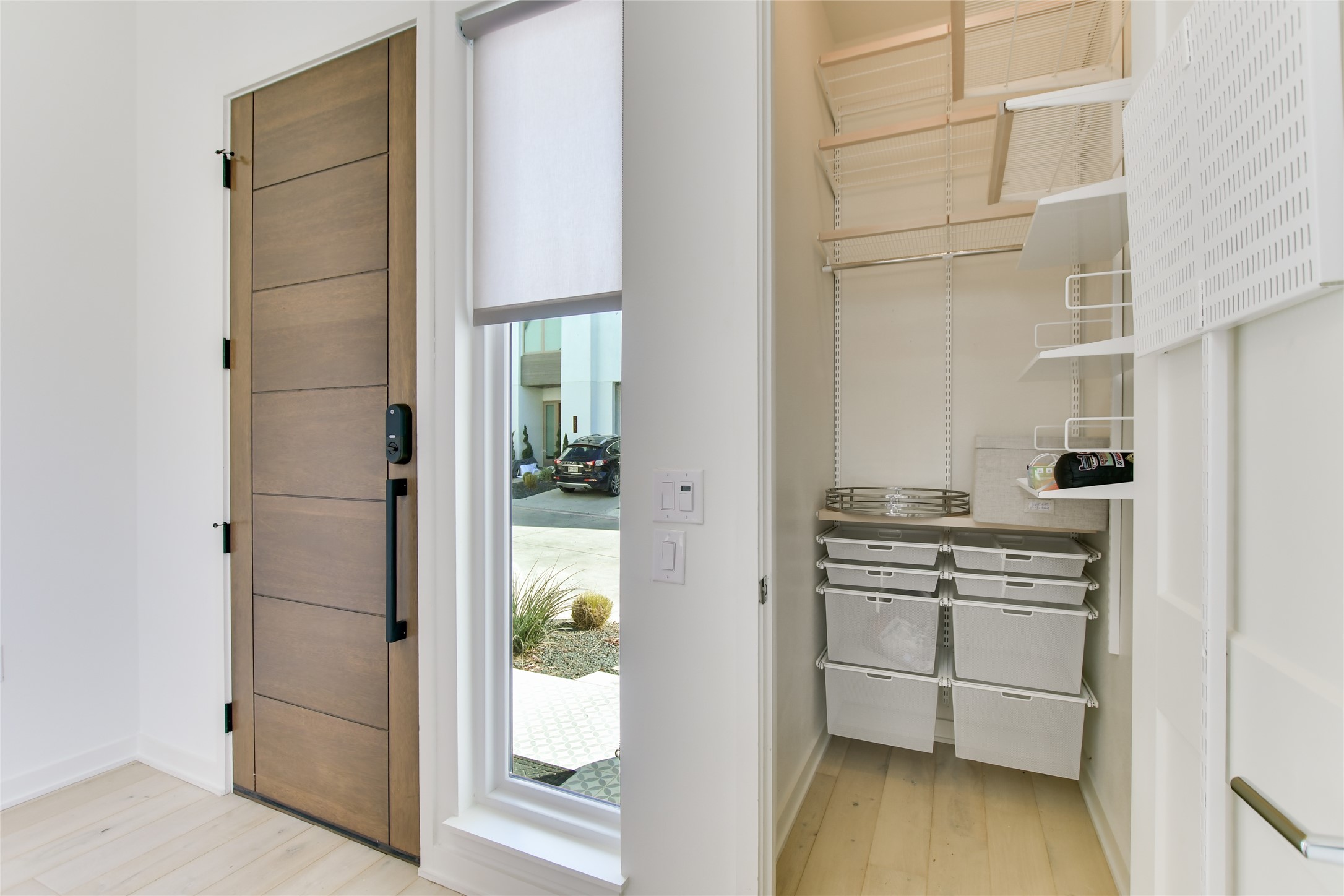 2606 Sutherland Street Austin, TX 78746 - Photo 2 of 22 Spacious light filled entry. The custom built in shelving in the closet is a wonderful upgrade