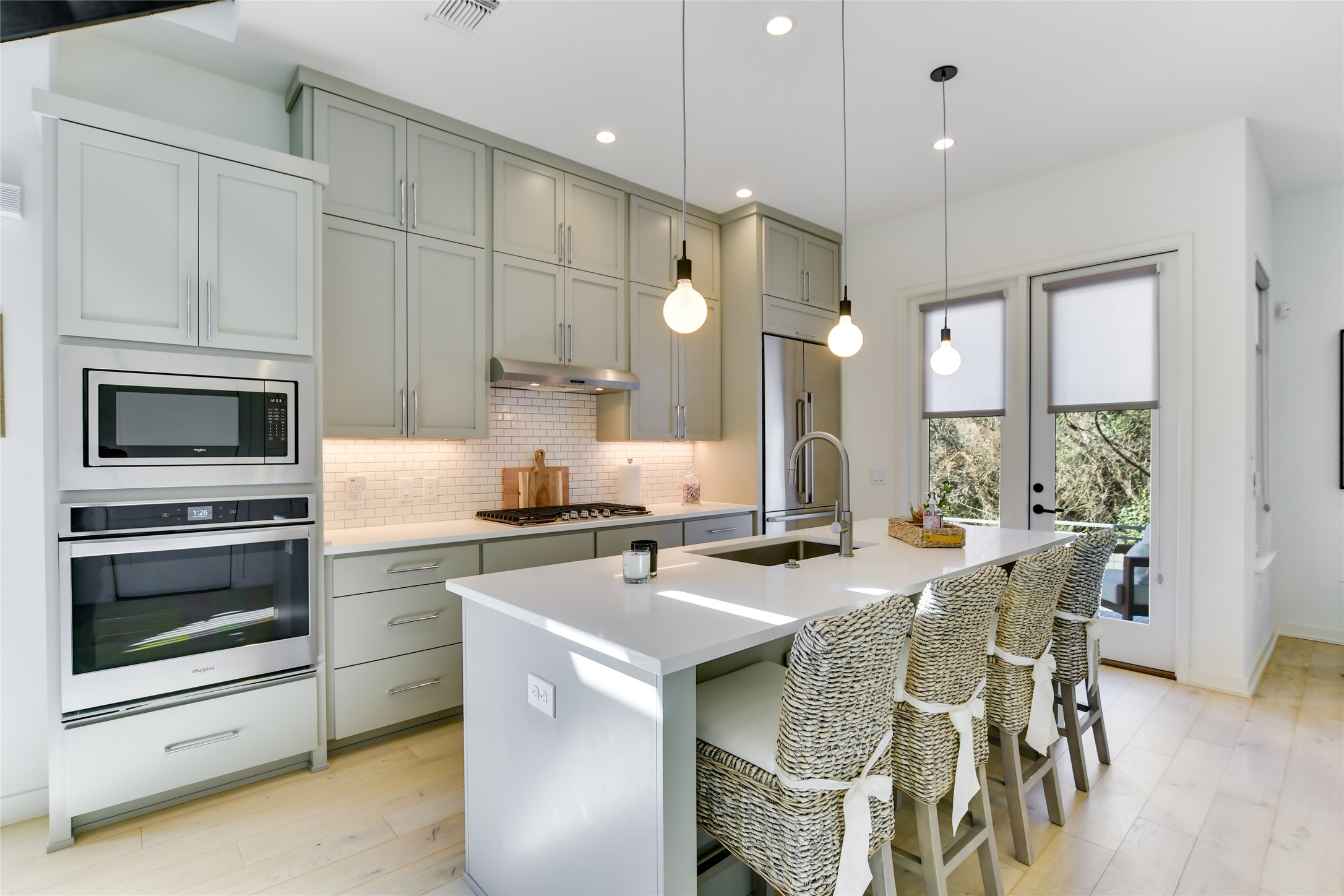 2606 Sutherland Street Austin, TX 78746 - Photo 6 of 22 An eat-in kitchen with a large island that opens to the main living space