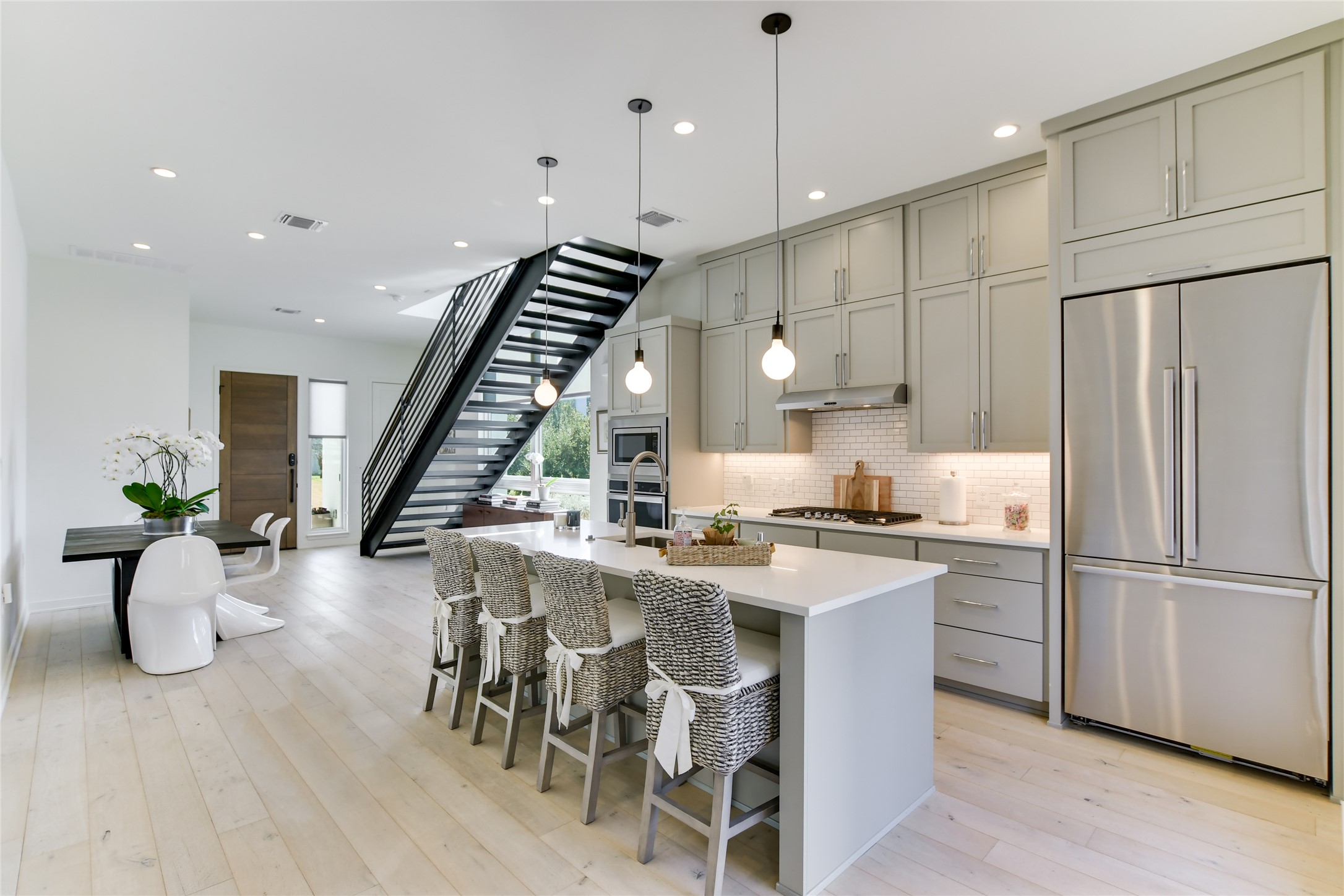 2606 Sutherland Street Austin, TX 78746 - Photo 7 of 22 The breakfast bar offers a convenient gathering place