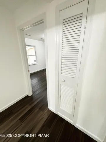 an entryway with a rug