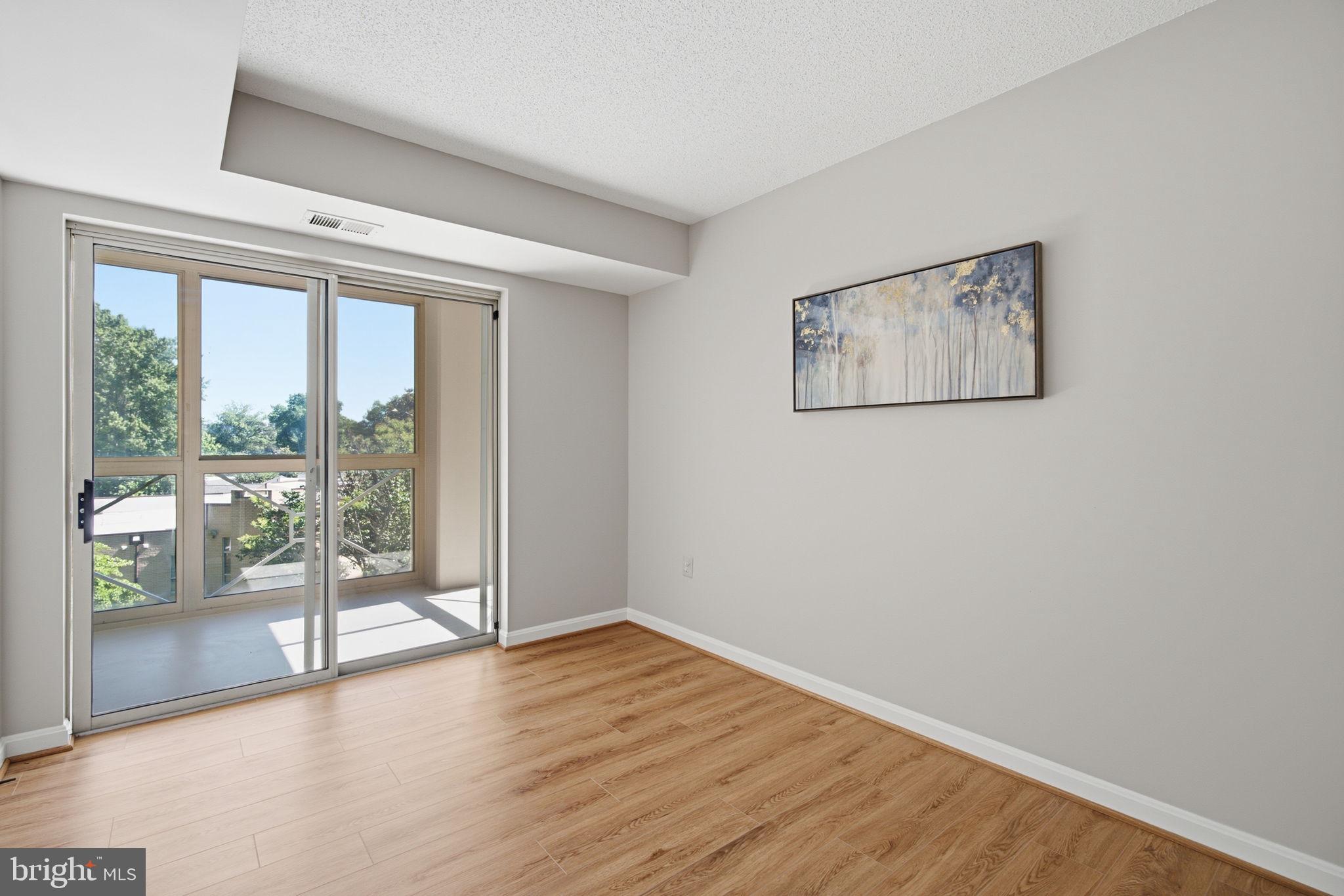 14805 Pennfield Circle, Unit 304 Silver Spring, MD 20906 - Photo 24 of 38 Den/Office with doors to enclosed balcony