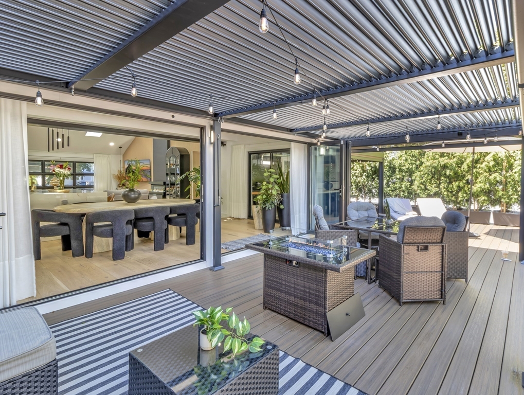 15 Appleton Street Saugus, MA 01906 - Photo 12 of 41 a living room with furniture large windows and wooden floor