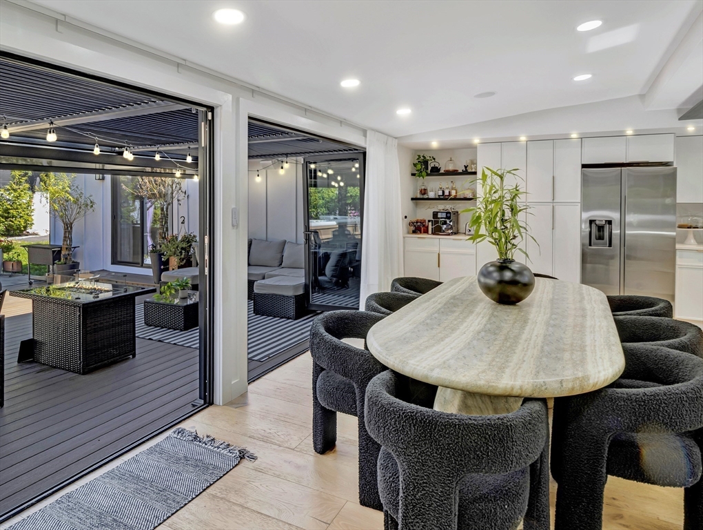 15 Appleton Street Saugus, MA 01906 - Photo 14 of 41 a kitchen with a dining table cabinets and refrigerator