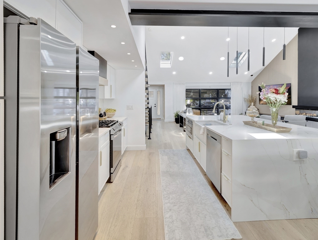 15 Appleton Street Saugus, MA 01906 - Photo 17 of 41 a kitchen with stainless steel appliances granite countertop a sink and a refrigerator