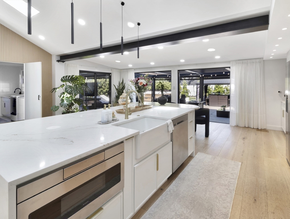 15 Appleton Street Saugus, MA 01906 - Photo 18 of 41 a large white kitchen with lots of counter space a sink appliances and cabinets