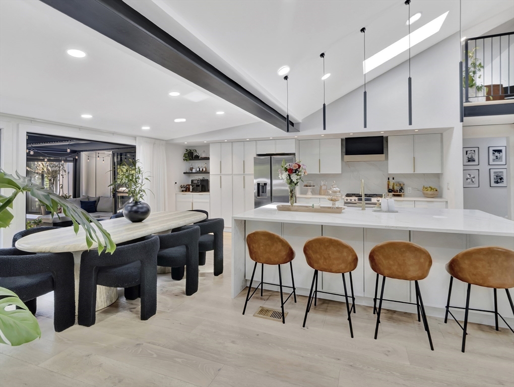 15 Appleton Street Saugus, MA 01906 - Photo 19 of 41 a room with stainless steel appliances kitchen island granite countertop a table chairs sink and cabinets