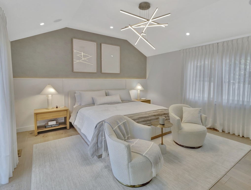 15 Appleton Street Saugus, MA 01906 - Photo 25 of 41 a bedroom with a bed and a chandelier