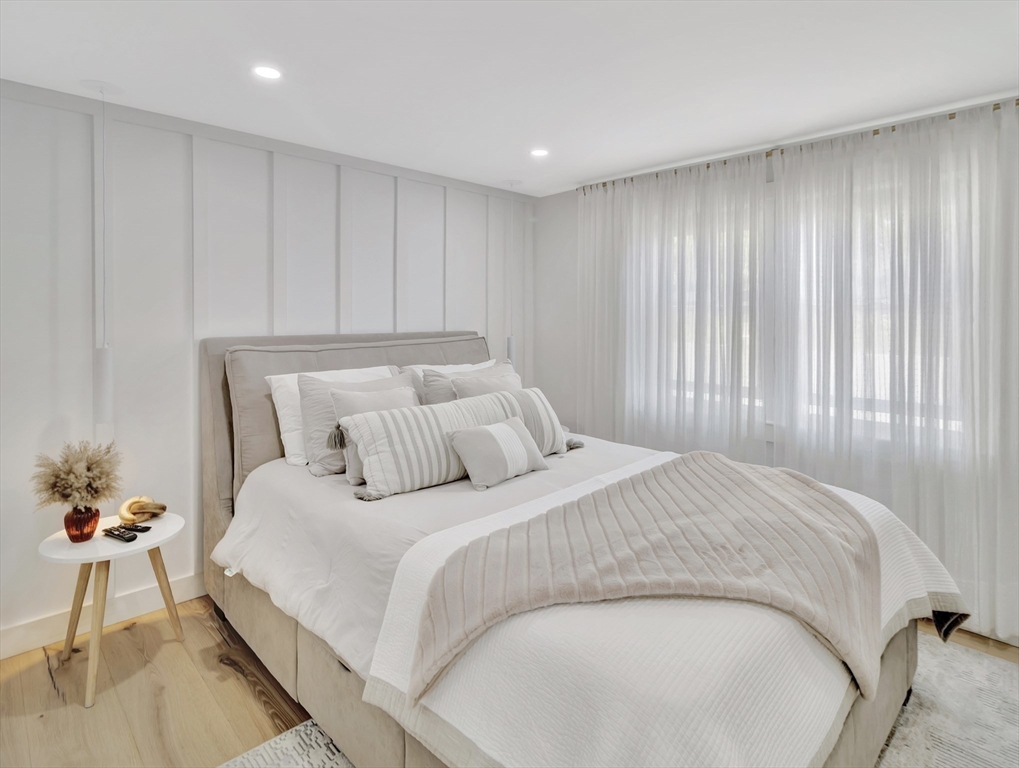 15 Appleton Street Saugus, MA 01906 - Photo 33 of 41 a bedroom with a bed and a potted plant