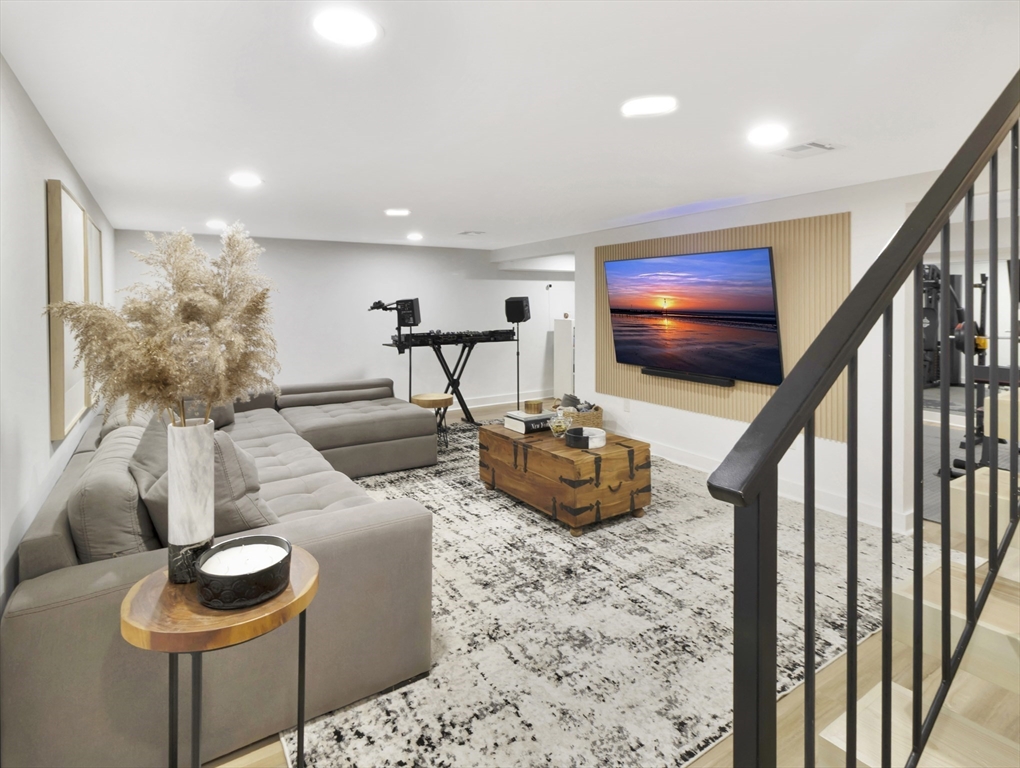 15 Appleton Street Saugus, MA 01906 - Photo 35 of 41 a living room with furniture and a flat screen tv