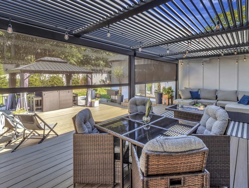 15 Appleton Street Saugus, MA 01906 - Photo 9 of 41 a view of a patio with table and chairs with wooden floor