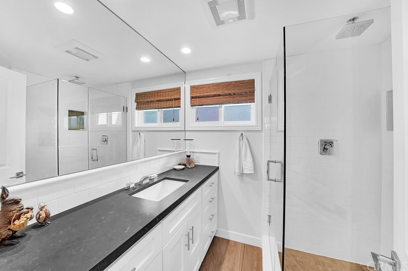 119 Via Nice Newport Beach, CA 92663 - Photo 14 of 30 a bathroom with a sink and a mirror