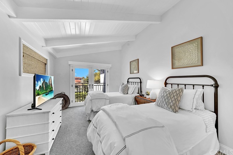 119 Via Nice Newport Beach, CA 92663 - Photo 26 of 30 a bedroom with bed and a flat tv screen on dresser