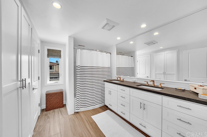 119 Via Nice Newport Beach, CA 92663 - Photo 27 of 30 a kitchen with granite countertop white cabinets and white appliances