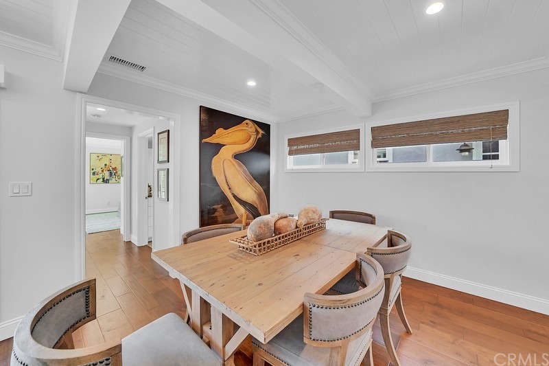 119 Via Nice Newport Beach, CA 92663 - Photo 8 of 30 a view of a dining room with furniture and wooden floor