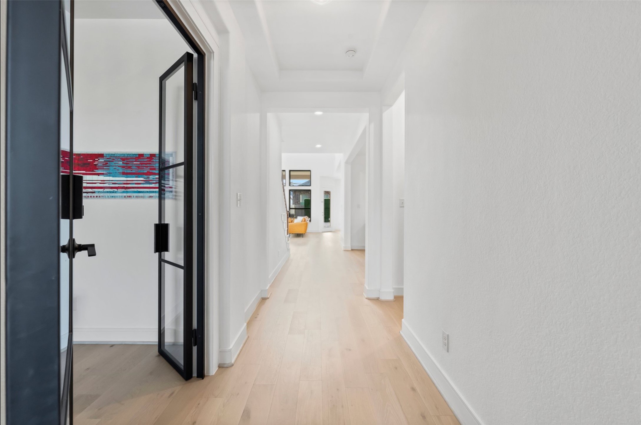 1053 Bat Hawk Court Conroe, TX 77385 - Photo 5 of 50 a view of a hallway with wooden floor and entryway