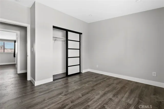 a bathroom with a toilet a sink a vanity and mirror