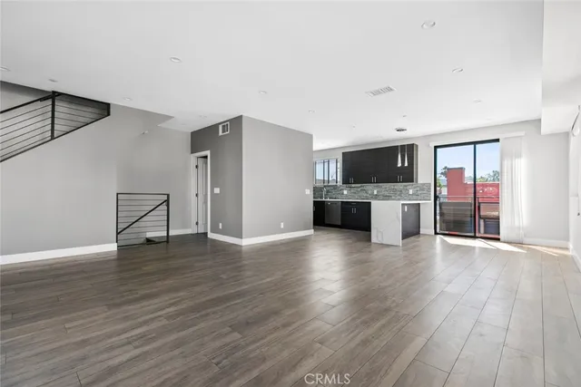 a view of a kitchen with a sink and a stove top oven