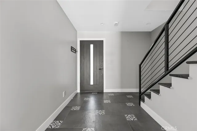 a view of an entryway with wooden floor