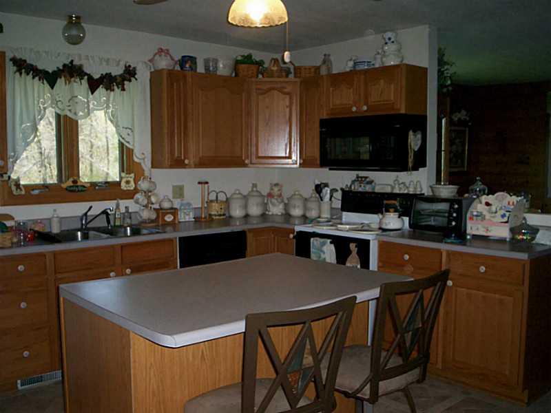 233 Davis Road Aliquippa, PA 15001 - Photo 4 of 14 Kitchen. Oak kitchen with center island which opens up to the living and dining area