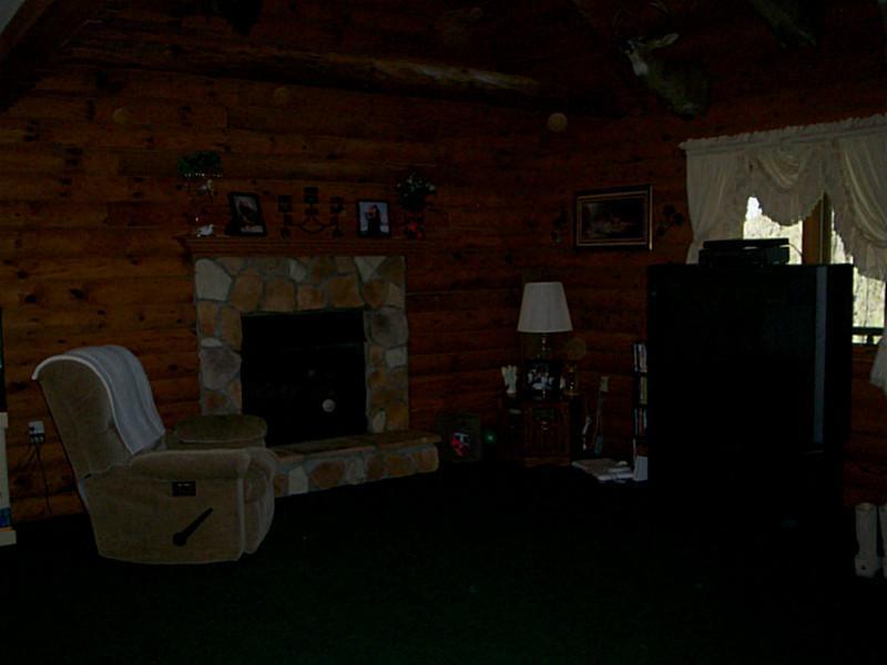 233 Davis Road Aliquippa, PA 15001 - Photo 7 of 14 Family Room. familyroom with log burning fireplace in the center and cathedral ceilings with a loft overlooking this room