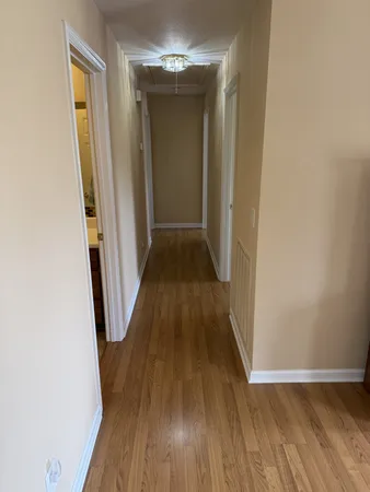 a bedroom with a bed and a mirror