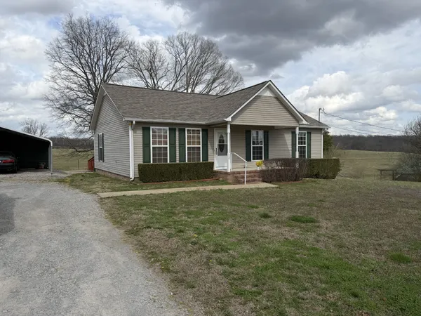 a kitchen with stainless steel appliances granite countertop a refrigerator and a stove