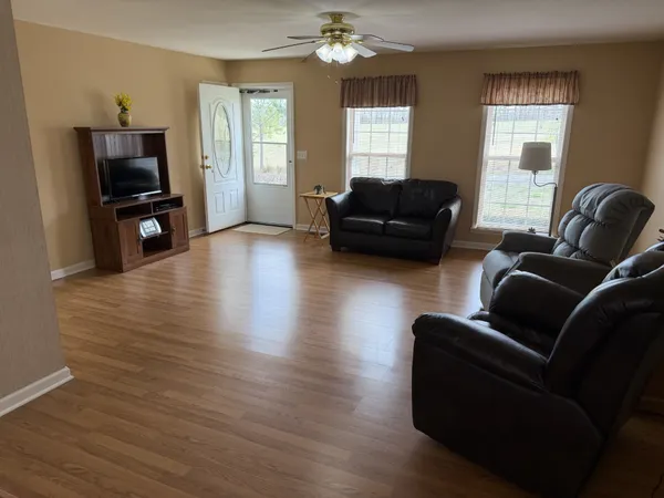 a living room with furniture and a window