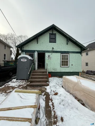 a view of a white house with a outdoor space