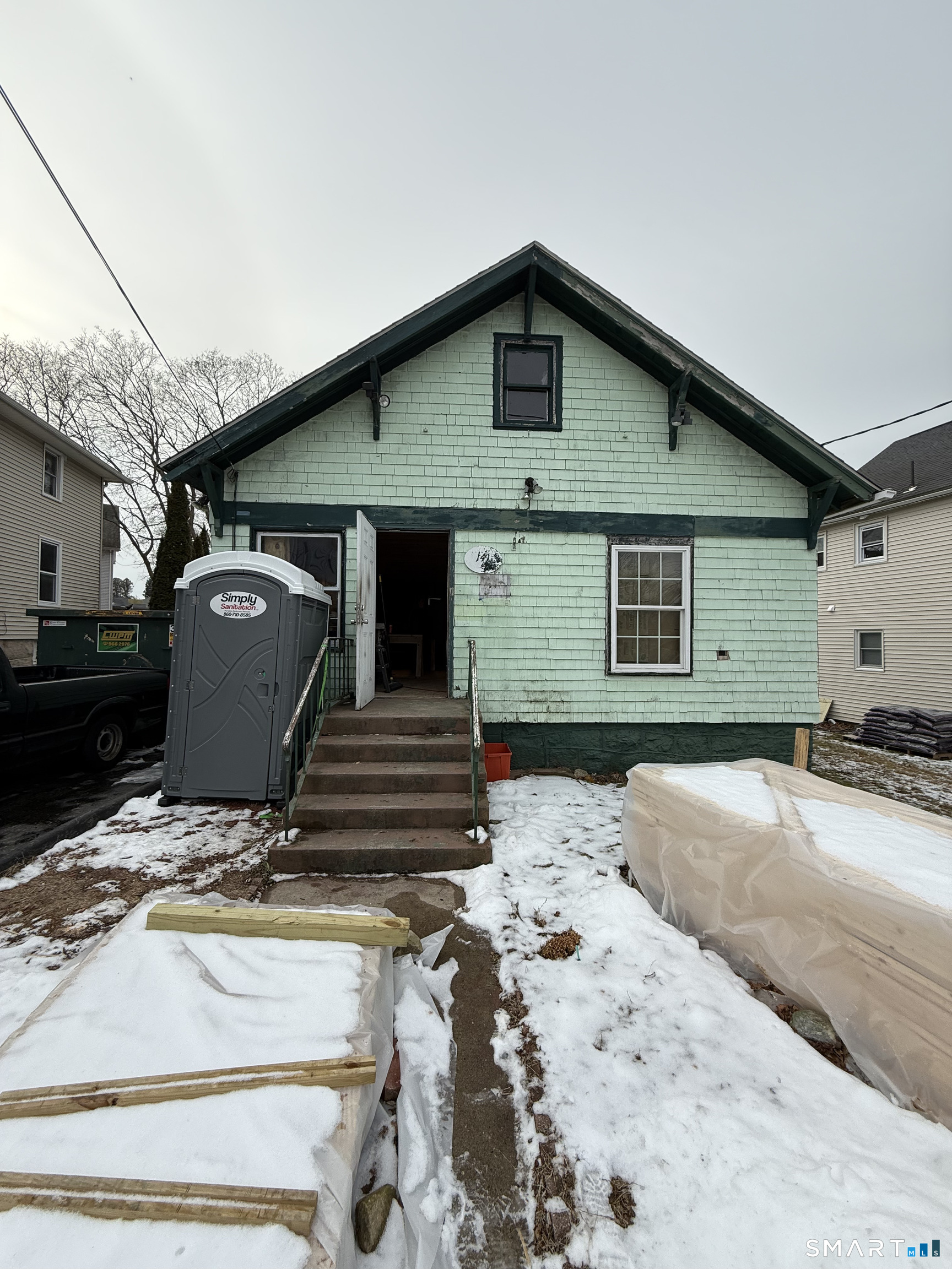 a view of a white house with a outdoor space