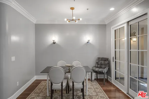 a workspace with furniture and chandelier