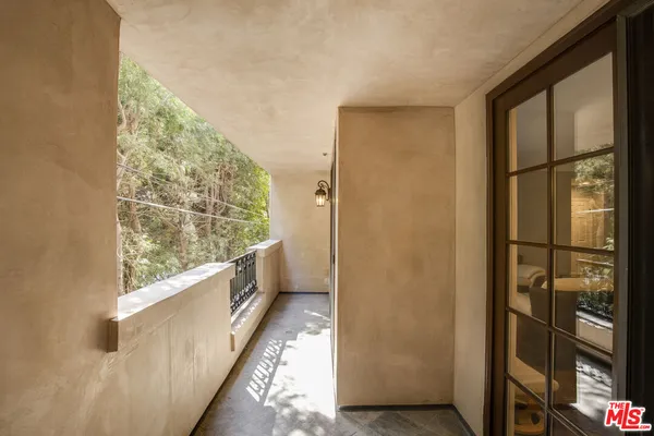 a bathroom with a large mirror and shower