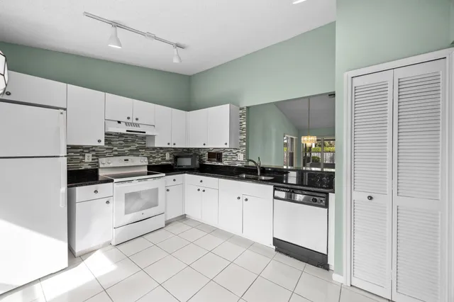 a view of a kitchen with furniture and window