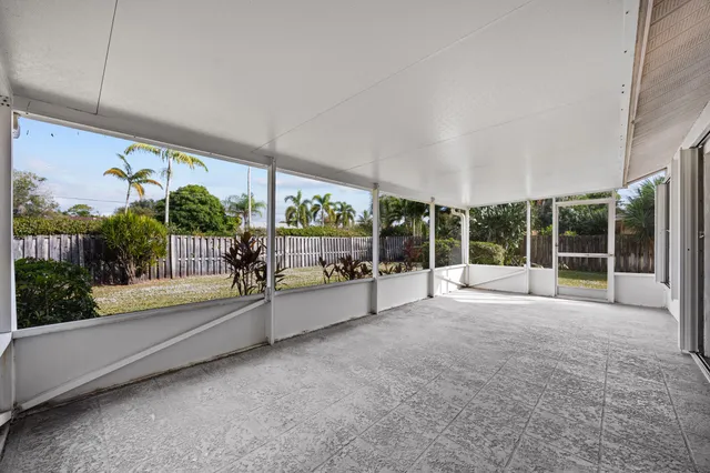 an aerial view of a houses with a yard